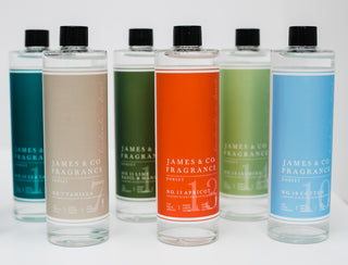 Shown are 6 bottles of reed refill. All in a variety of colours and fragrances.