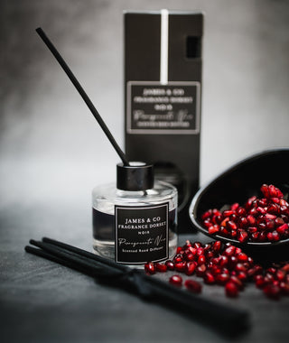 Our vegan-friendly Pomegranate Noir 100ml reed diffuser - notes of ripe plum, sweet chamomile and fresh herbs, with amber, earthy patchouli and rich incense.
