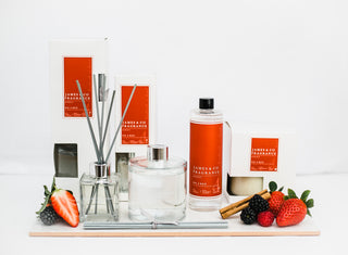 Various items from our No.4 red collection  including a reed diffuser, candle and refill oil.