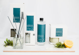 Various pieces from the No.3 Blue collection sitting against a white background. This includes a reed diffuser, a candle and a refill oil.