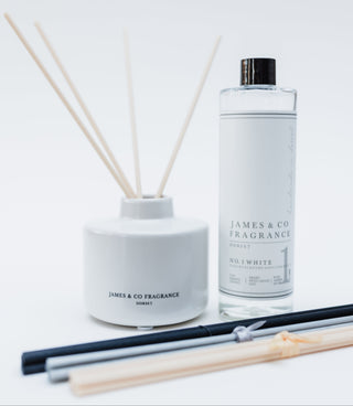 Reed diffuser set with bottle and sticks on a white background