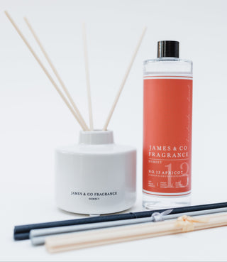 Reed diffuser set with a bottle labeled 'James & Co Fragrance' on a white background