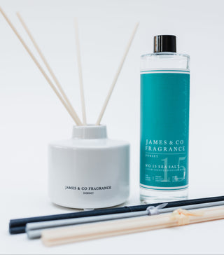 Reed diffuser set with a bottle labeled 'James & Co Fragrance' on a white background