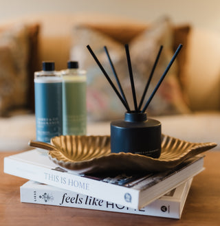 Diffuser on a stack of books with a blurred background
