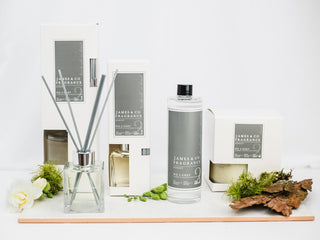 Various pieces from the No.2 Grey range, including a reed diffuser, candle and refill oil.