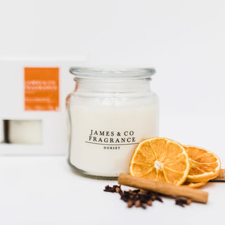 Our No. 6 Orange 60-hour candle sat with sweet tangerine slices, cinnamon sticks, and a handful of cloves