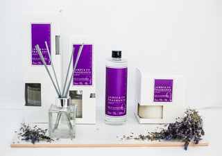 Various pieces from the no.9 lavender collection, including a reed diffuser, a candle and a refill oil.