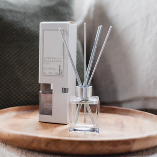 Our best-selling fragrance - No. 1 White 100ml reed diffuser sits on a wooden surface.